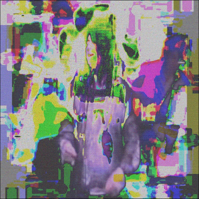 Medium-long shot high angle of Anohni Hegarty singing on stage. Blobs and splotches of white yellow magenta lime and blue distort the entire image.