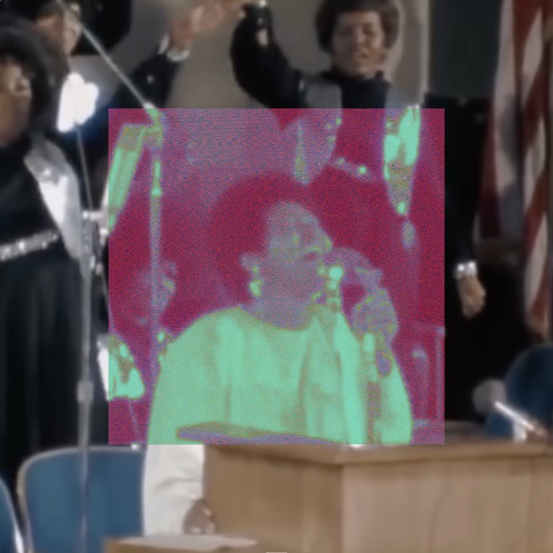 A medium shot of Aretha Franklin singing into a microphone at a church podium, wearing a light-colored outfit. Behind her, robed choir members fill the frame alongside other musicians; an American flag is visible in the upper right. A large centered square covering roughly half the image is filled with intense magenta and lime green distortion, inverting and oversaturating the original warm film tones where Aretha stands. The outer edges of the image retain the natural color of the church setting.